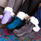 Pudus Winter Cable Knit Chenille Slipper Socks in Lavender with Fuzzy Pom Poms and Faux Fur Sherpa Fleece Lining