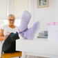 Pudus Winter Cable Knit Chenille Slipper Socks in Lavender with Fuzzy Pom Poms and Faux Fur Sherpa Fleece Lining